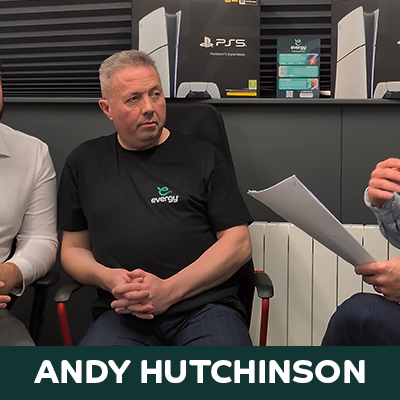 Andy Hutchinson, Head of EV Charging Sales at Evergy, sitting during an EV discussion.